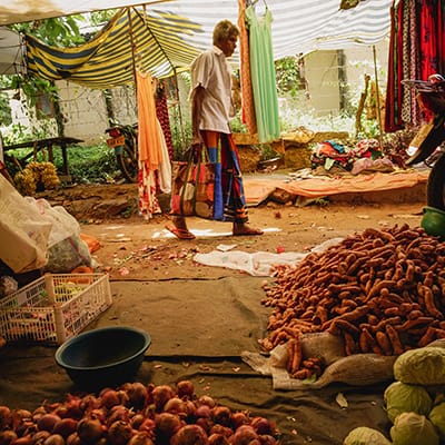 Man walking through spice and vegetables market in Sri Lanka